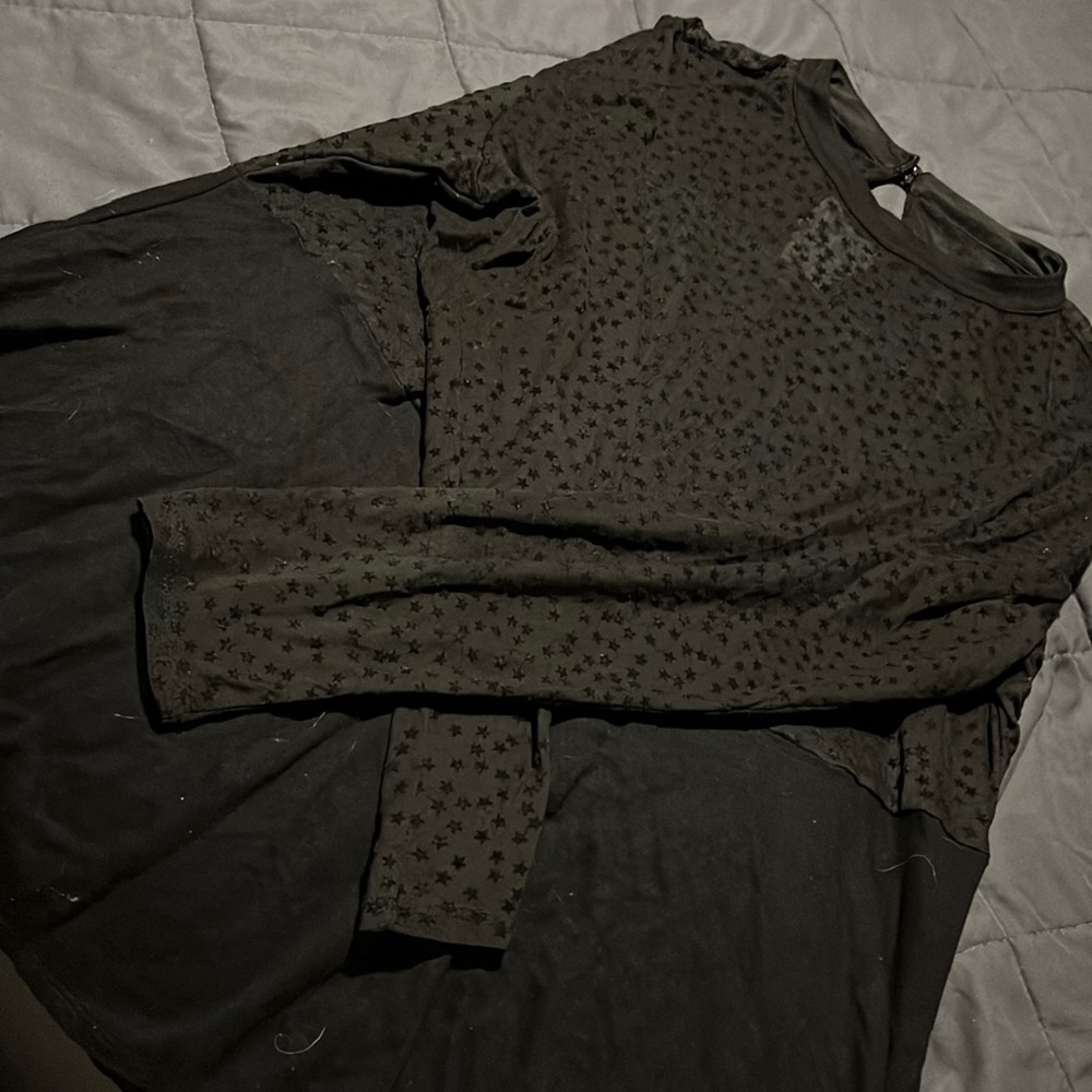 Torrid Black long sleeve blouse stitch stars on upper half.
